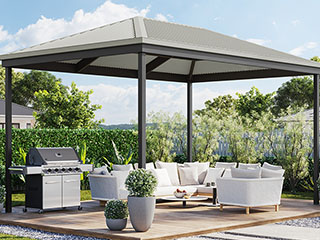 Pergola with a Hip roof fitted out with stylish outdoor furniture and a BBQ