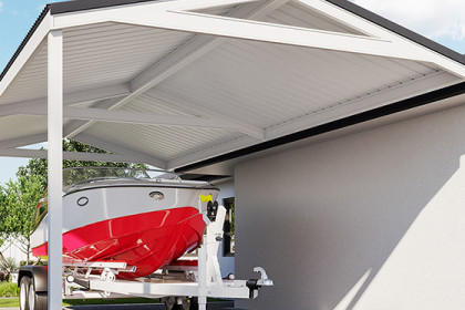 Gable roof carport with red boat parked beneath