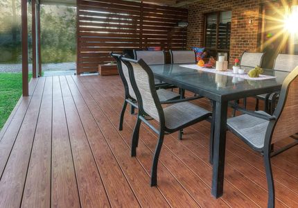 Timber deck flooring on a verandah with an outdoor table setting