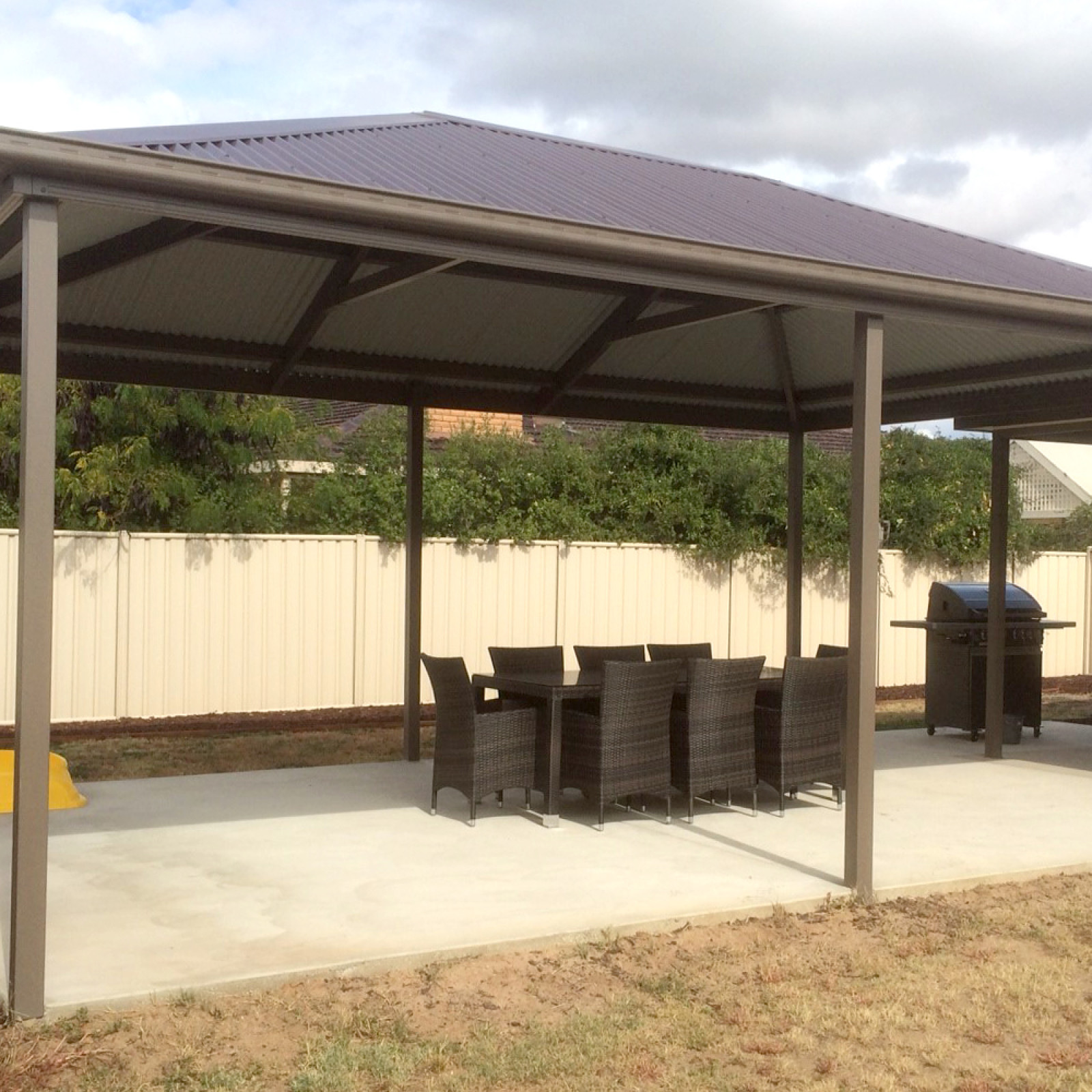 Hip roof patio attached to dwelling