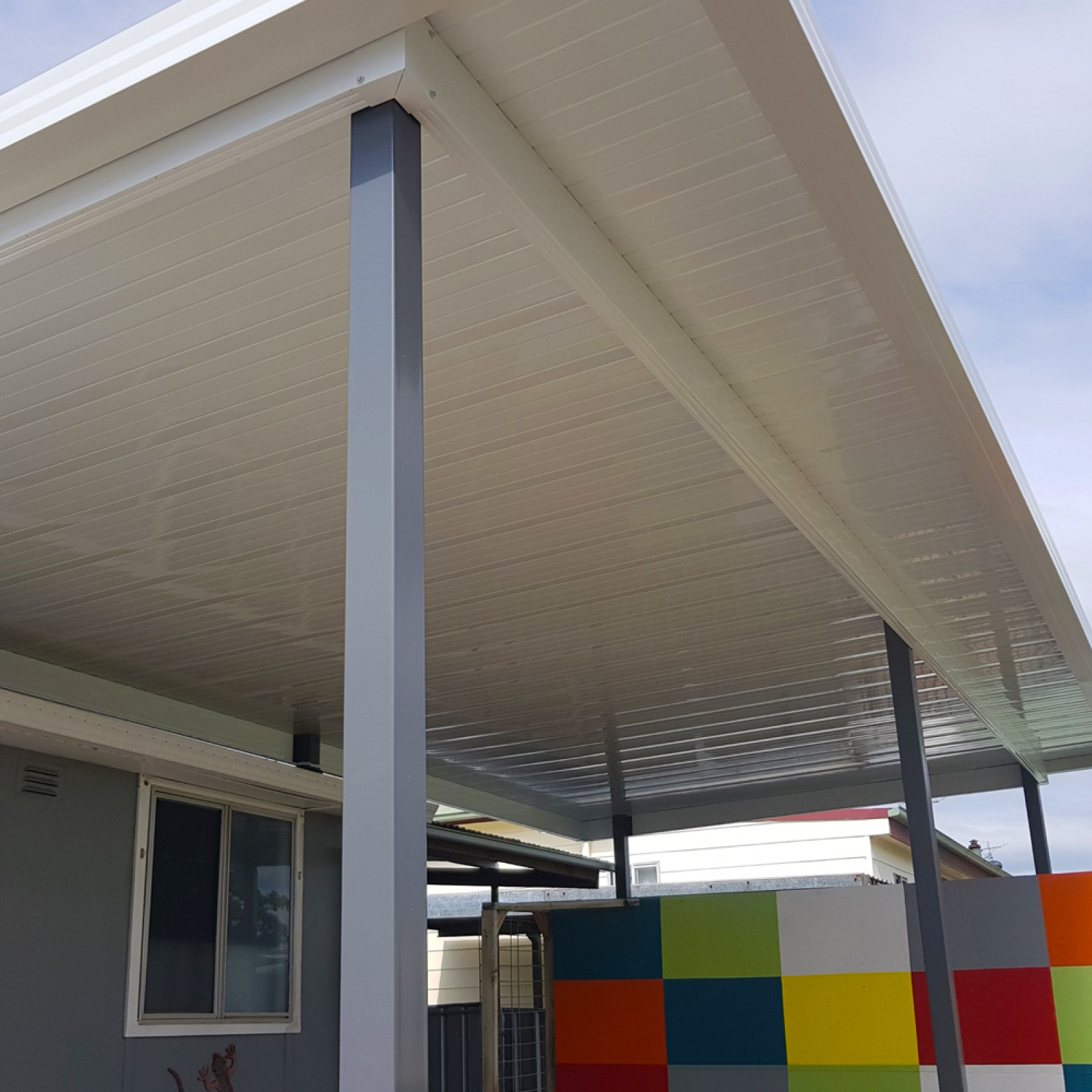 Flat roof patio with sunset sheets